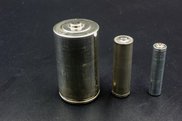 set of batteries on black background