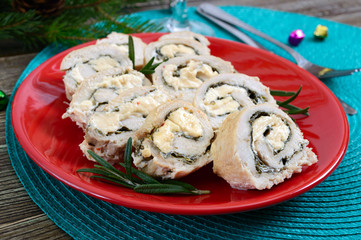 Baked turkey rolls with spinach, mozzarella on plate. Healthy tasty lunch. New Year and Christmas appetizer.