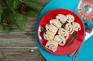 Baked turkey rolls with spinach, mozzarella on plate. Healthy tasty lunch. New Year and Christmas appetizer. The top view. Flat lay.