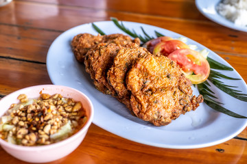 Thai Fried Fish Cake with tomato slice and sweet Chilli Dipping Sauce.