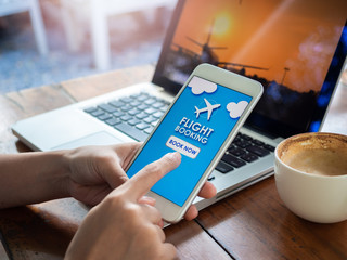 Fototapeta na wymiar Flight booking online with smartphone.