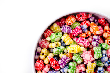 Beads in the form of colorful butterflies and turtles.