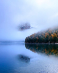 Dolomites Reflection in water in Lago di Braies (Braies lake, Pragser wildsee) South Tyrol, Italy ;...