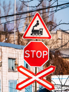 Railroad crossing signs in the open air.