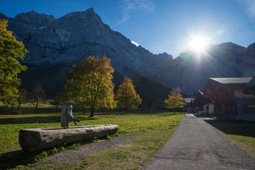 Eng Alp village at karwendel valley, last sun rays over the mountain ridge, austrian autumn...