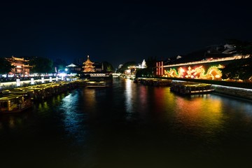 Fototapeta na wymiar Night scene over Qinhuai river in Confucius Temple in Nanjing city