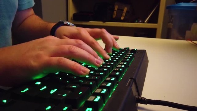 Typing on a green gaming keyboard