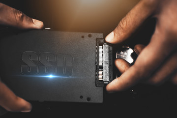 Connect the SSD hard drive to the laptop.