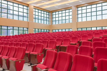 Conference room with red seats.
