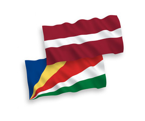 Flags of Latvia and Seychelles on a white background
