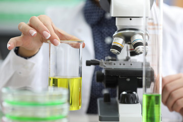 Doctor investigating sample in lab