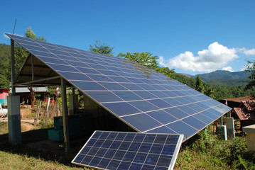 Photovoltaic power system on mountain with blue sky.
