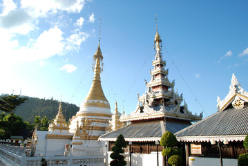 Fototapeta premium Wooden and golden pagoda in northern of Thailand.