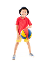 attractive young sporty smiling boy throws a basketball ball on a white background