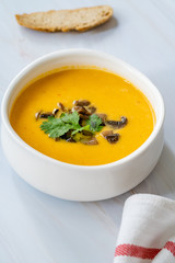 Homemade Thai Sweet Potato Soup with Cilantro, Coconut Milk Cream, Lime and Mushrooms.
