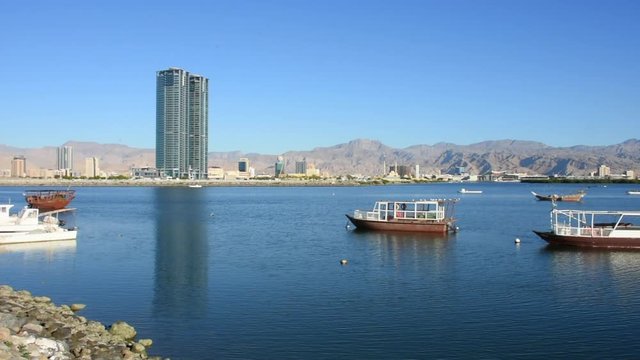 Panorama of Ras al Khaimah View from the Corniche towards downtown, the crisp mountains in the late winter sunset
