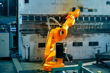 Robotic arm on heavy factory assembly line is moving