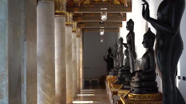 Bangkok, Thailand - Wat Benchamabophit Temple Courtyard Hallway Surrounded With Different Buddha Statue Images - Medium Shot