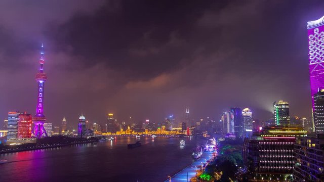 Chinese boats on Huangpu at Shanghai skyscrapers timelapse pan up