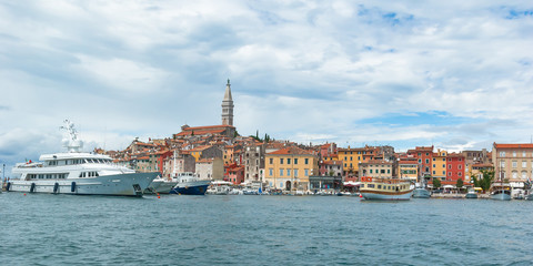View of the port of Rovinj and old colorfull city on a sunny summer day.