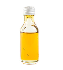 CBD Oil in glass of bottle on white background.