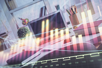 Forex market chart hologram and personal computer background. Double exposure. Concept of investment.