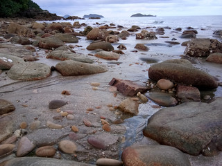 Fototapeta na wymiar Stack rock on the beach on low tide time.