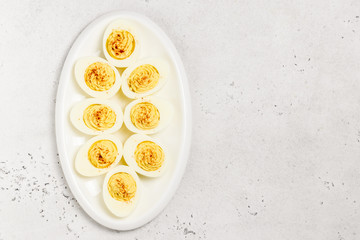 Easter snack, devilled eggs with smoked paprika. Top view, copy space.