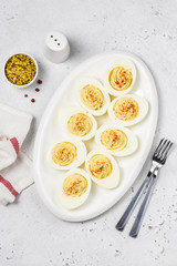 Classic devilled eggs with smoked paprika. Top view, copy space.