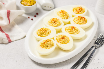 Classic devilled eggs with smoked paprika. Selective focus, copy space.