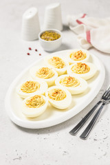 Classic devilled eggs with smoked paprika. Selective focus, copy space.