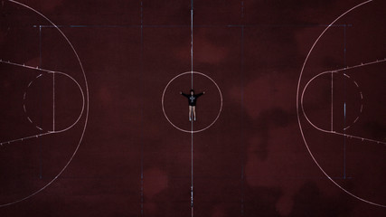Girl in the center of basketball court