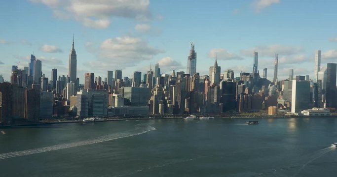 Epic timelapse of NYC East River Skyline. Empire State, chrysler building, United Nations, Sunrise to sunset, with clouds and boats. 4k+ shot on a Canon 1Dx Raw.