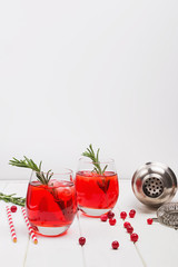 Cranberry cocktail with rosemary and ice