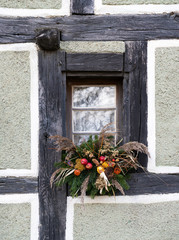 beautiful window decorations in a half-timbered house made entirely out of natural materials