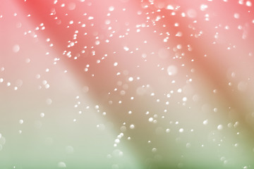 Abstract bokeh light sparkle on red and green wave luxury background