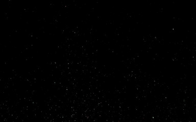 White snow on a black sky. Winter background. Christmas background concept