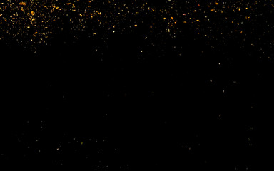 Fototapeta na wymiar Abstract background with golden shiny sparkling sparkles.