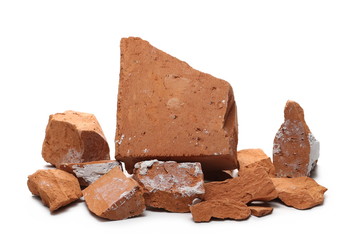 Shattered, broken bricks isolated on white background