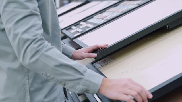 Man choosing ceramic tile in domestic shop