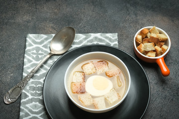Hearty lunch. Meat broth or bouillon  from veal with breadcrumbs on a dark background. Top view. Copy space.