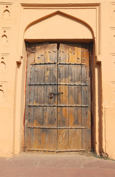Antique wooden door at Amber Fort, Jaipur India