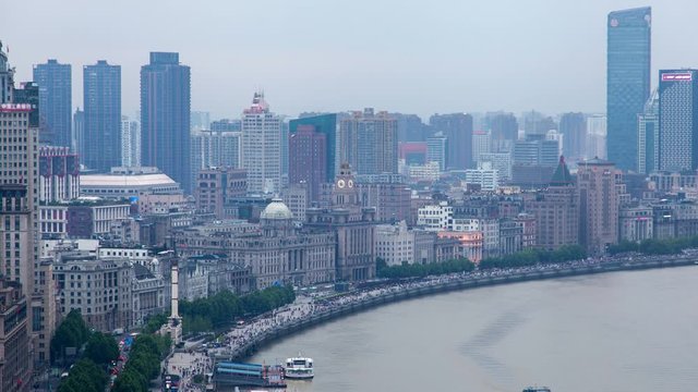 Huangpu river with Shanghai boats at Bund in China timelapse pan up