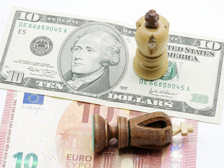 Trade Concept: King Chess Pieces On US Dollar And Euro Banknotes, Isolated On White Background, USA winning