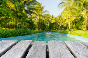 table on the background of swimming pool in garden