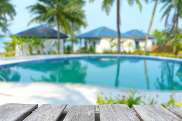 table on the background of swimming pool in tropical resort