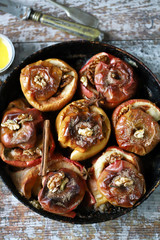 Baked apples with cinnamon. Cooking baked apples. Selective focus. Macro.