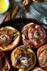 Baked apples with cinnamon. Cooking baked apples. Selective focus. Macro.