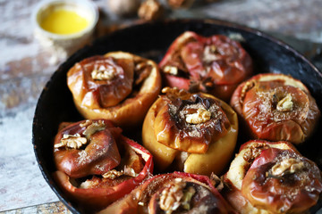Baked apples with cinnamon. Cooking baked apples. Selective focus. Macro.
