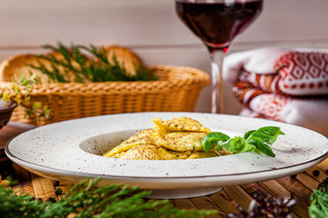 Fototapeta na wymiar Italian food. Ravioli with feta cheese. Serving in a restaurant with Ukrainian style. Copy space, background image